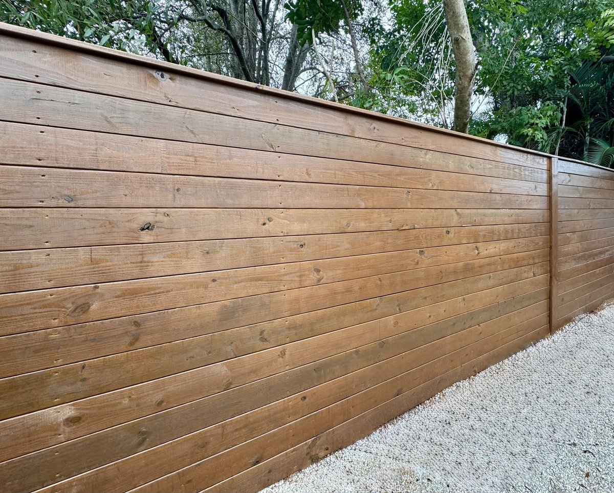 Costa Key Fence horizontal wood privacy fence installation at a residential property in Sarasota County, Florida